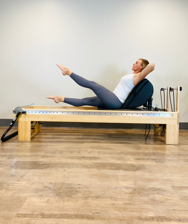 Strengthen and Stretch with Scissors Pilates on the Arc Barrel